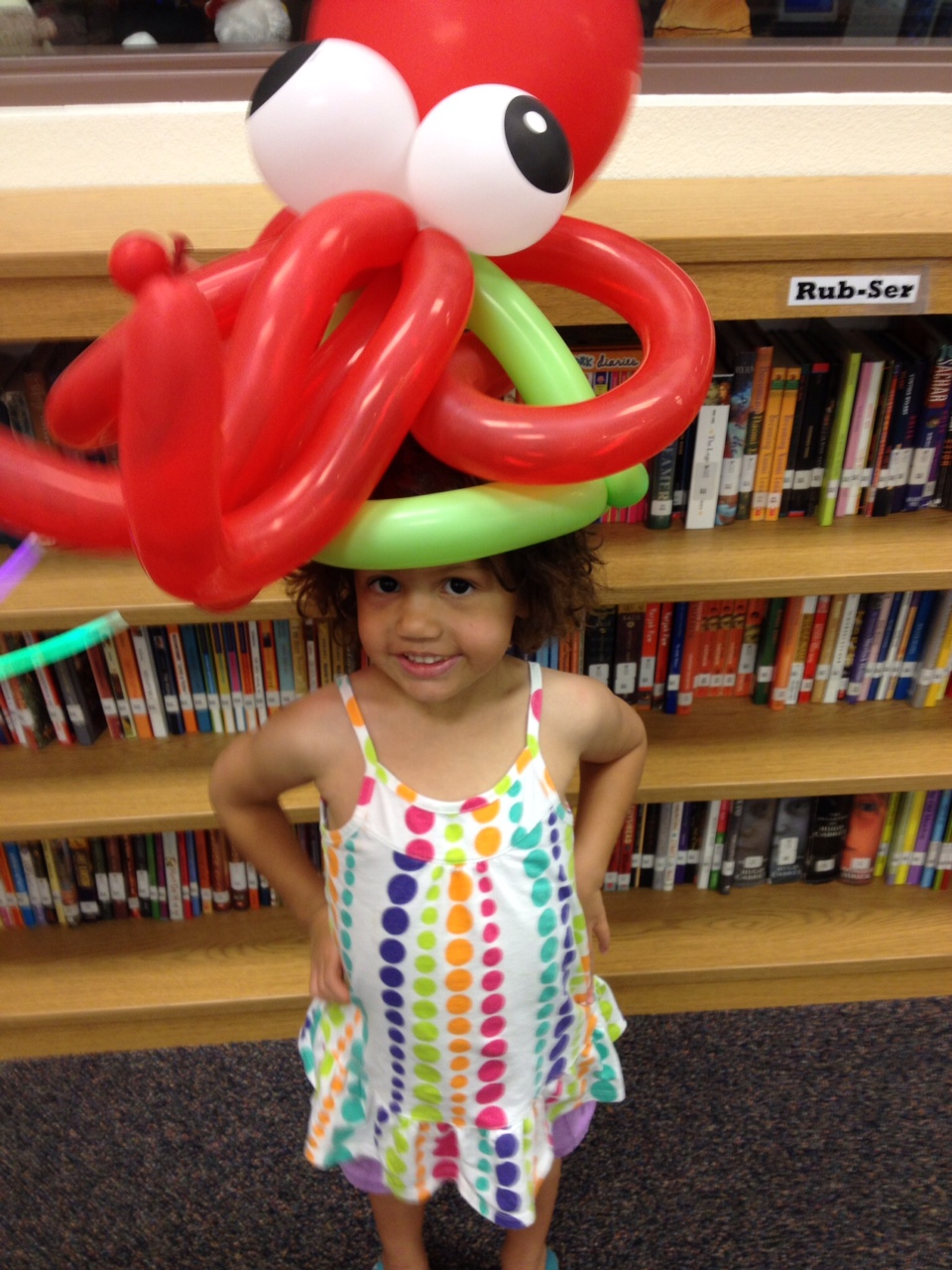 Keira wearing an octopus balloon hat at the library 28 June 2012